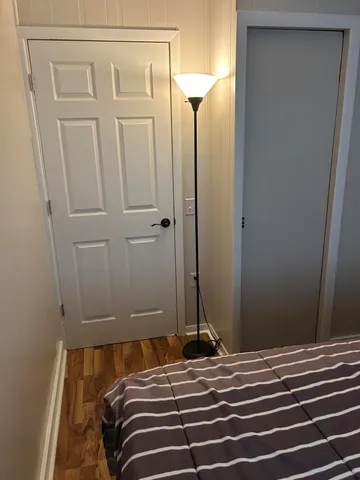 a bathroom with a toilet sink vanity and mirror