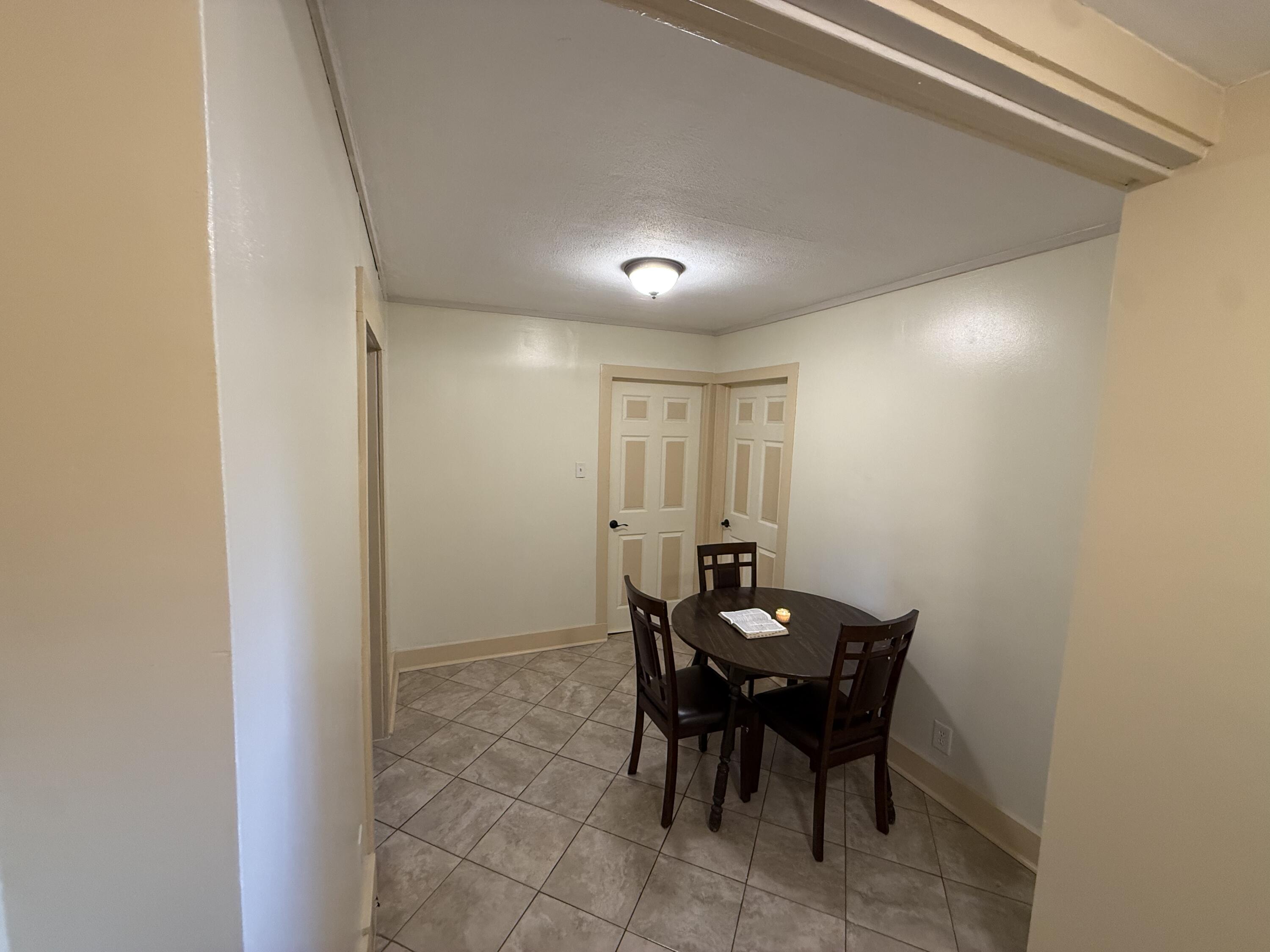 1038 Ridge Street Hammond, IN 46324 - Photo 16 of 31 a view of a dining room with furniture and wooden floor
