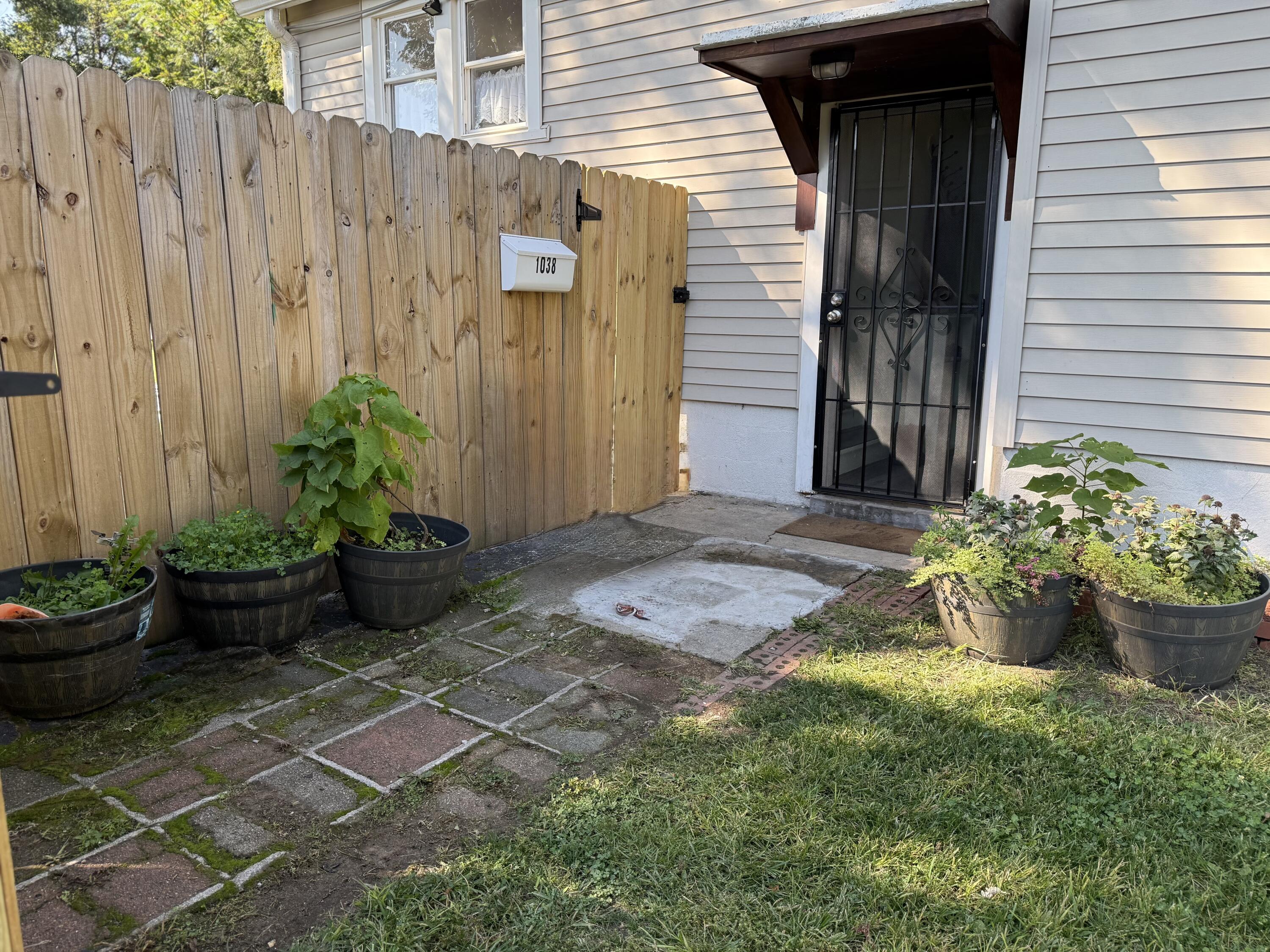1038 Ridge Street Hammond, IN 46324 - Photo 2 of 31 a view of a backyard with potted plants