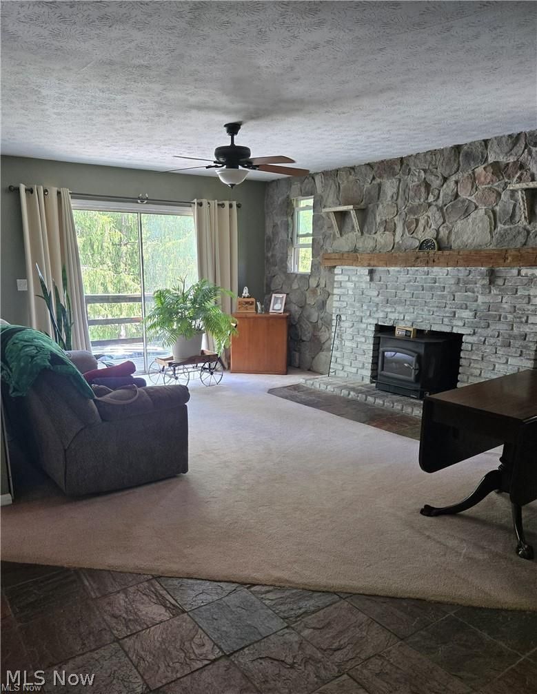 14640 Stone Road Newbury, OH 44065 - Photo 12 of 19 From the living room area asliding glass door offers a great view of the hillside and access to the balcony
