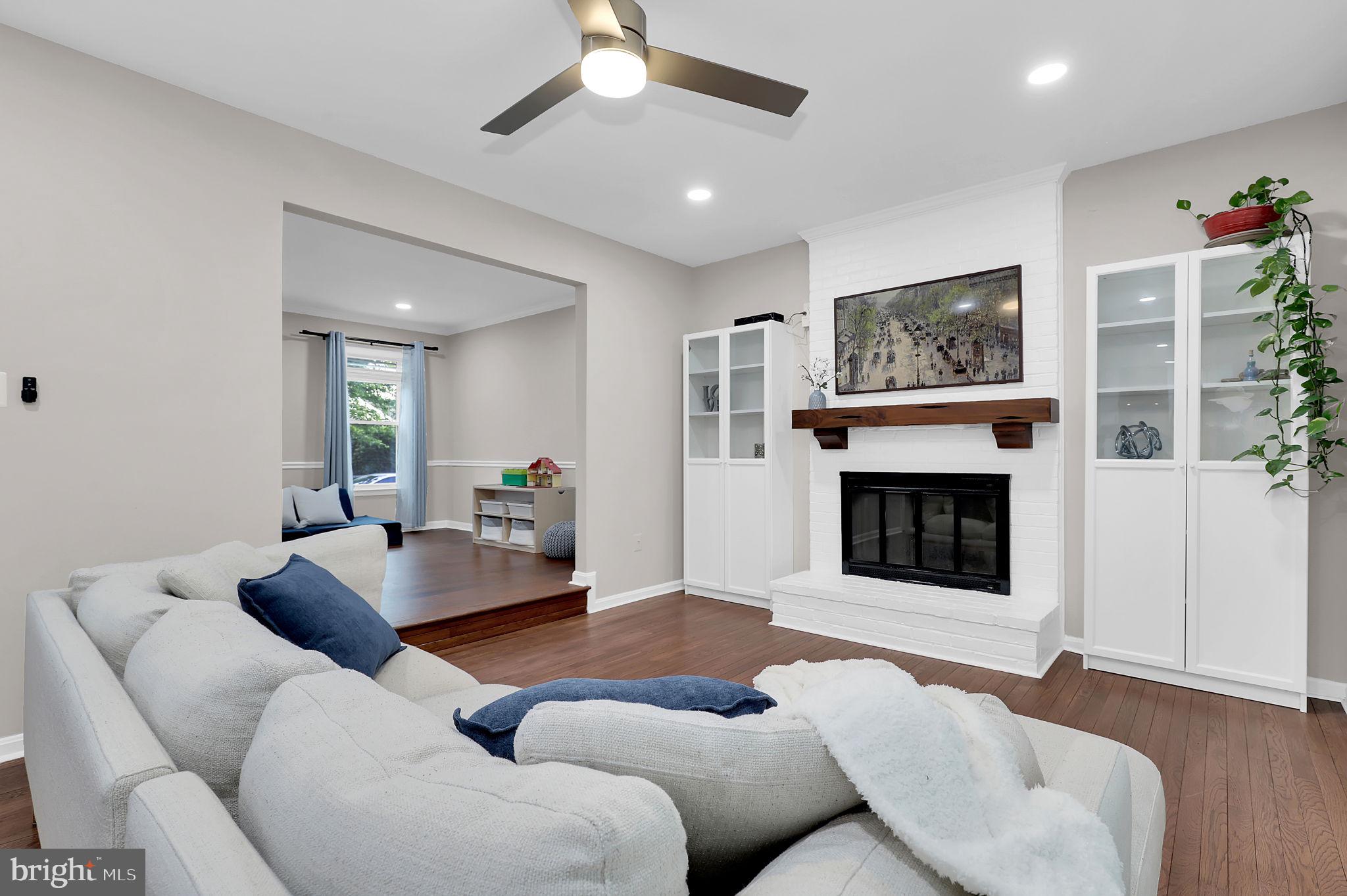 14901 Running Ridge Lane Silver Spring, MD 20906 - Photo 2 of 49 a living room with furniture and a fireplace