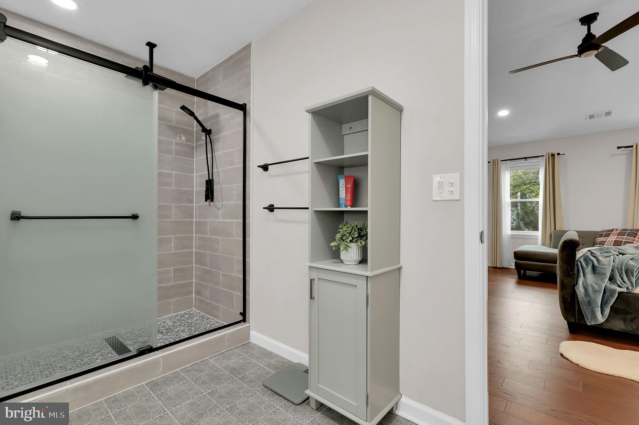 14901 Running Ridge Lane Silver Spring, MD 20906 - Photo 25 of 49 a view of walk in closet with clothes and shoes