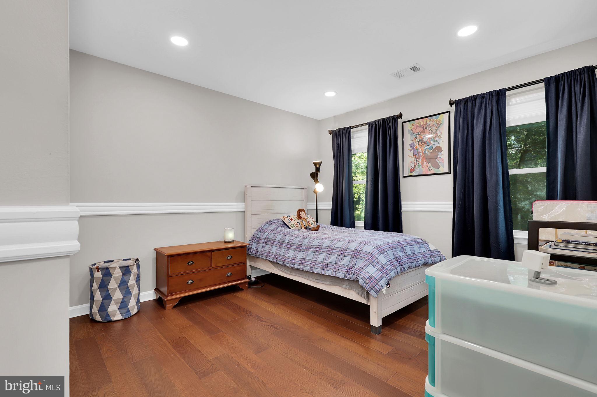 14901 Running Ridge Lane Silver Spring, MD 20906 - Photo 28 of 49 a bedroom with a bed and large window