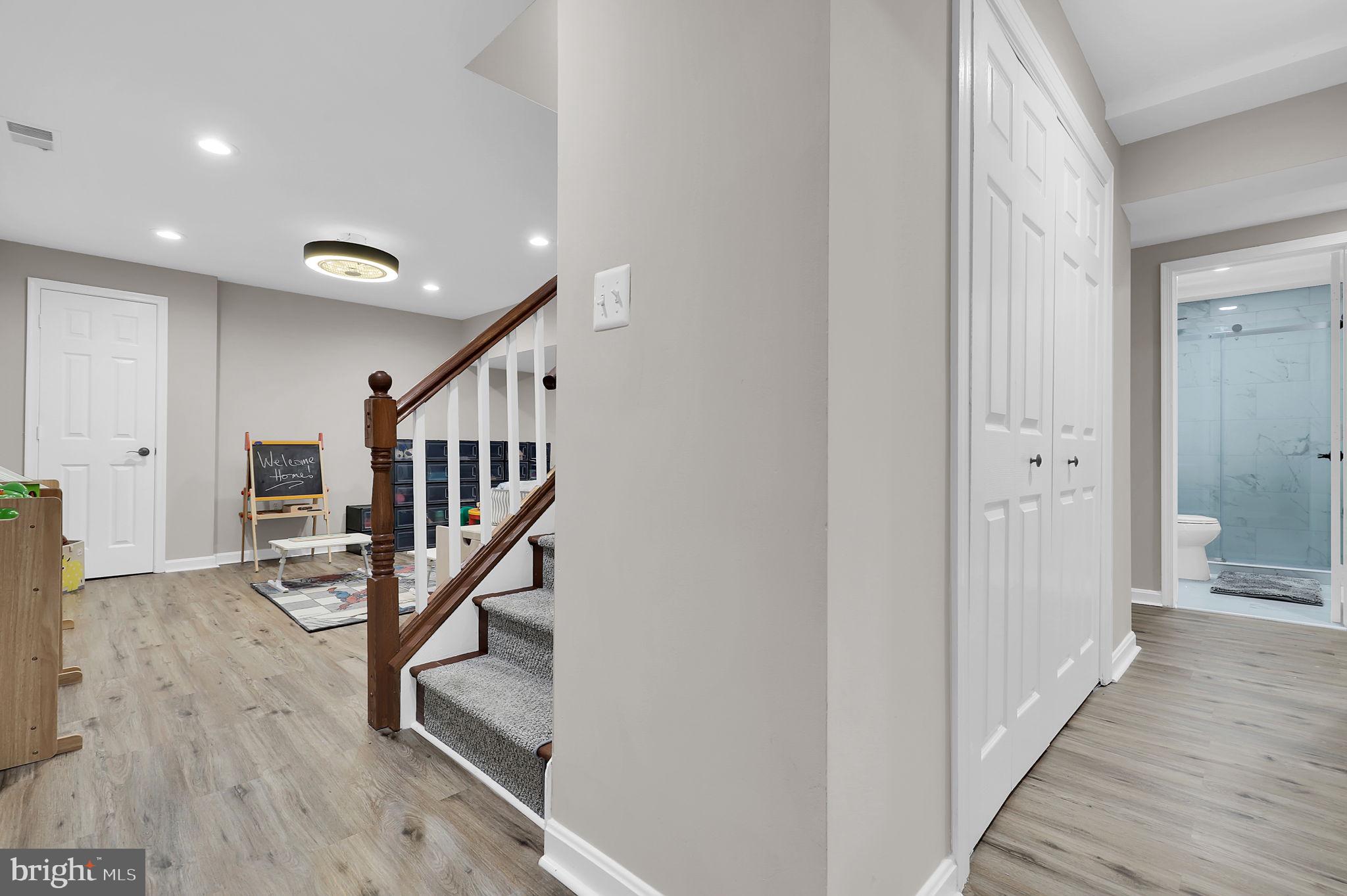 14901 Running Ridge Lane Silver Spring, MD 20906 - Photo 29 of 49 a view of entryway with wooden floor and stairs