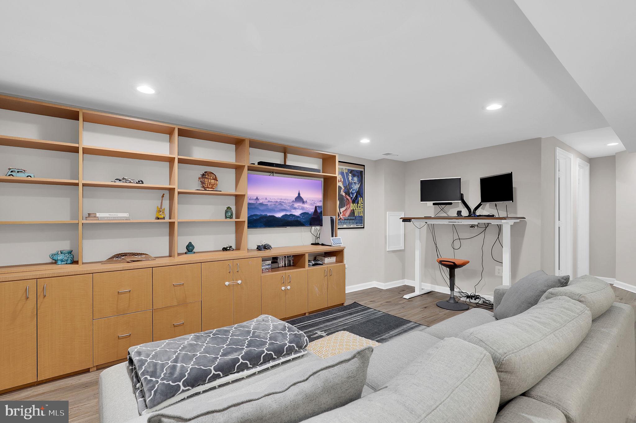14901 Running Ridge Lane Silver Spring, MD 20906 - Photo 30 of 49 a living room with furniture and a flat screen tv