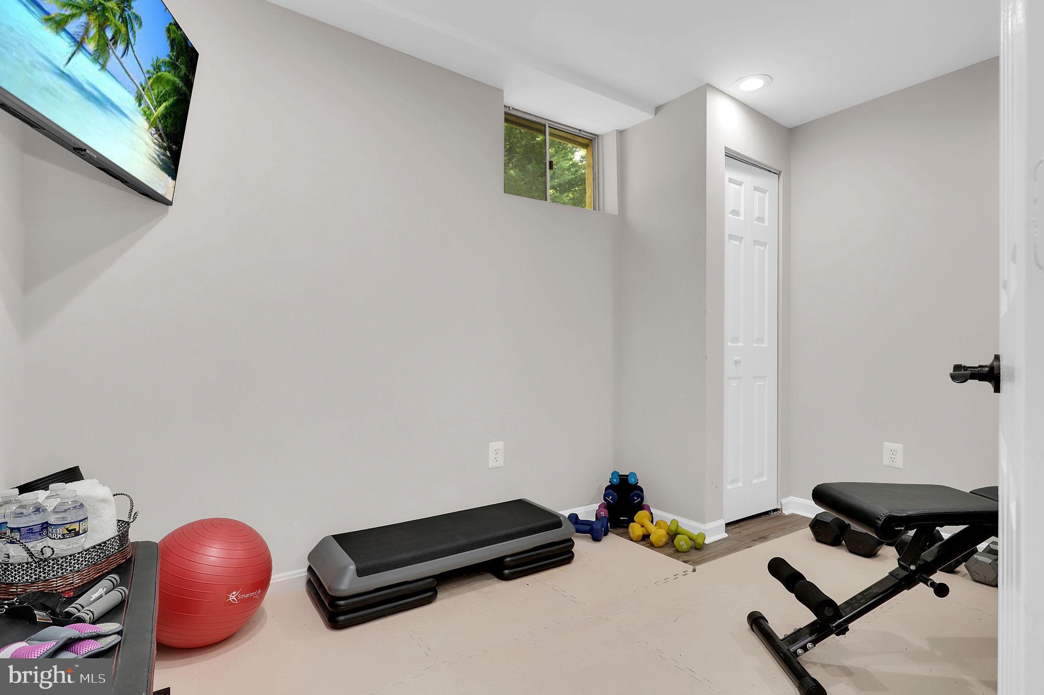 14901 Running Ridge Lane Silver Spring, MD 20906 - Photo 35 of 49 a bedroom with a bed and a chandelier