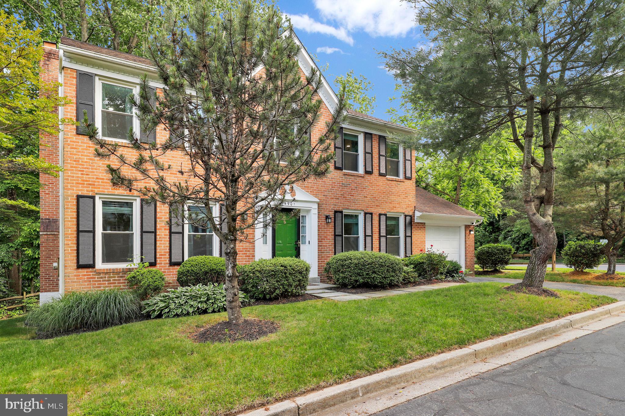 14901 Running Ridge Lane Silver Spring, MD 20906 - Photo 37 of 49 a front view of a house with a garden