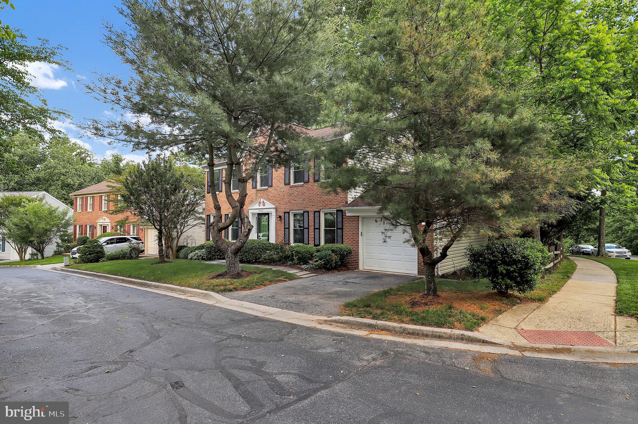 14901 Running Ridge Lane Silver Spring, MD 20906 - Photo 39 of 49 a view of a house with a yard and large trees