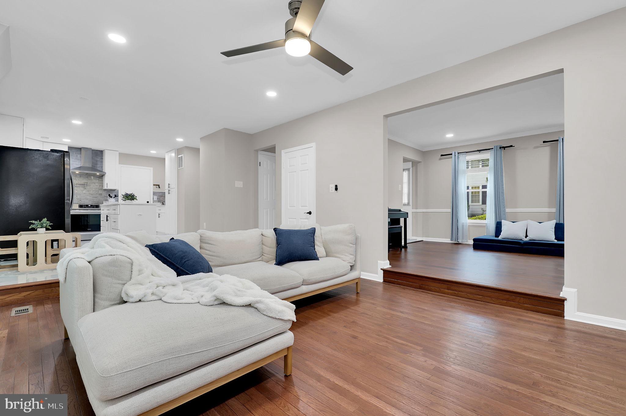 14901 Running Ridge Lane Silver Spring, MD 20906 - Photo 4 of 49 a living room with furniture and a flat screen tv