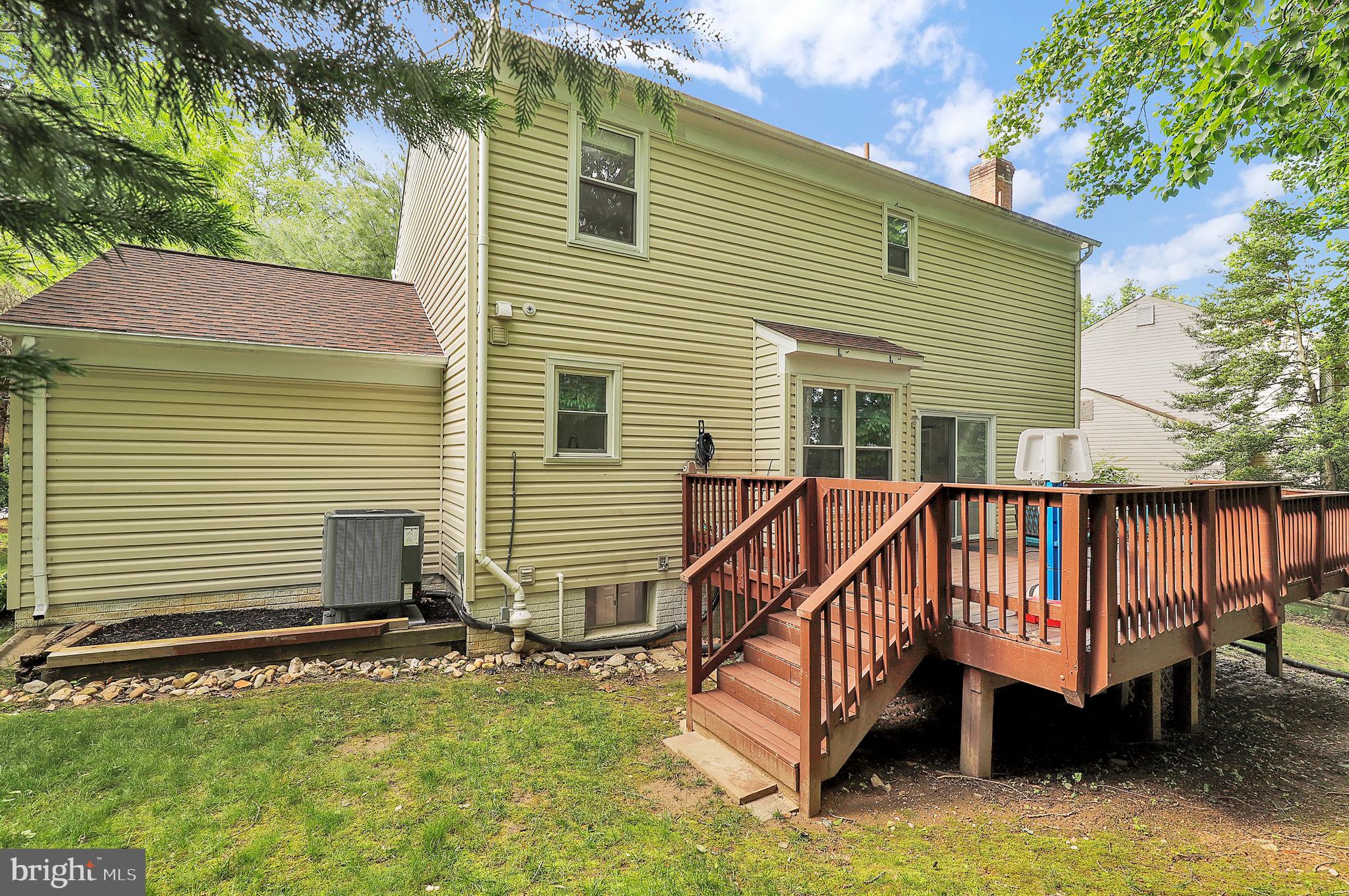 14901 Running Ridge Lane Silver Spring, MD 20906 - Photo 43 of 49 a view of a house with a yard and a wooden deck