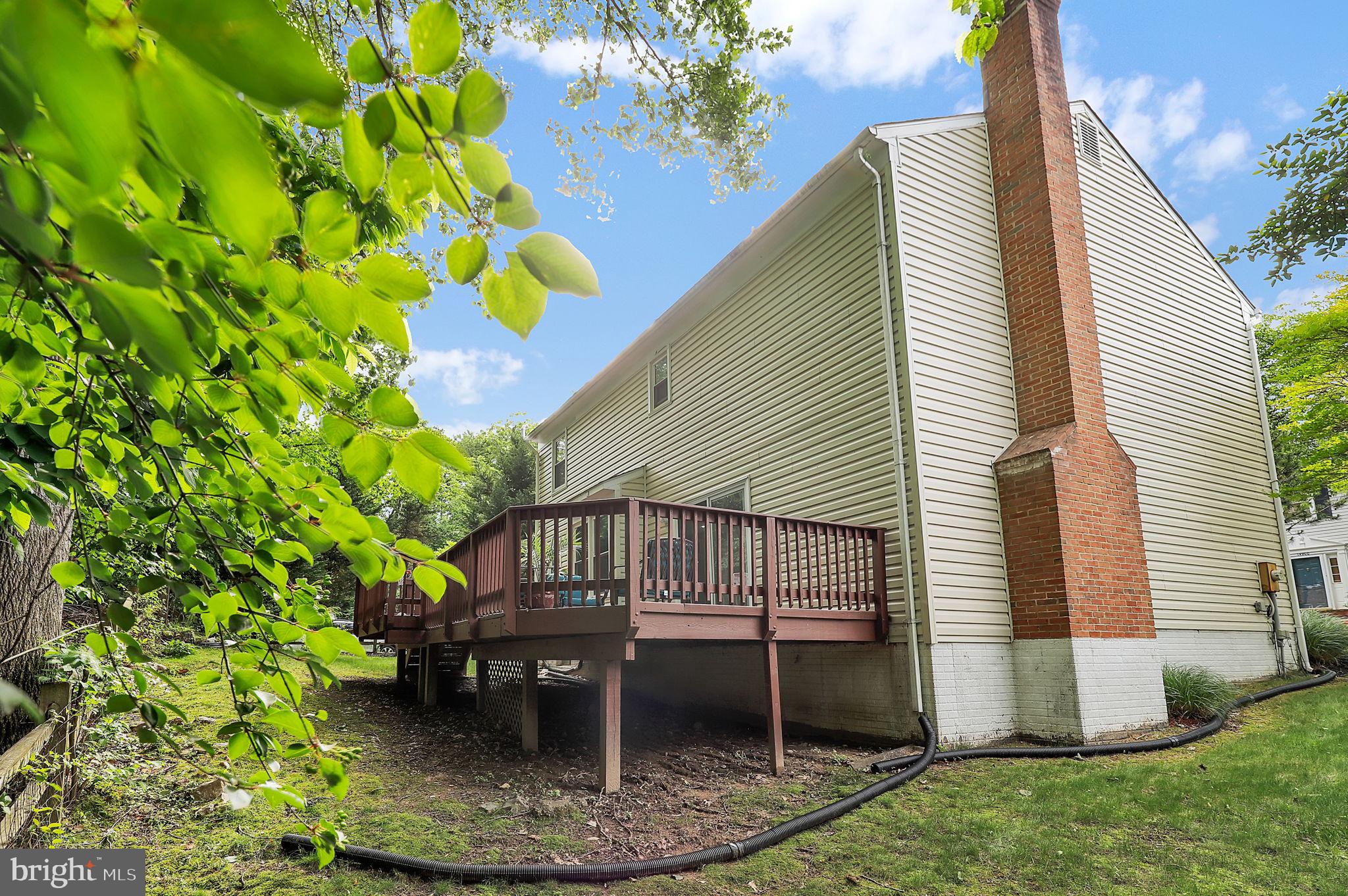 14901 Running Ridge Lane Silver Spring, MD 20906 - Photo 44 of 49 a front view of a house with a yard
