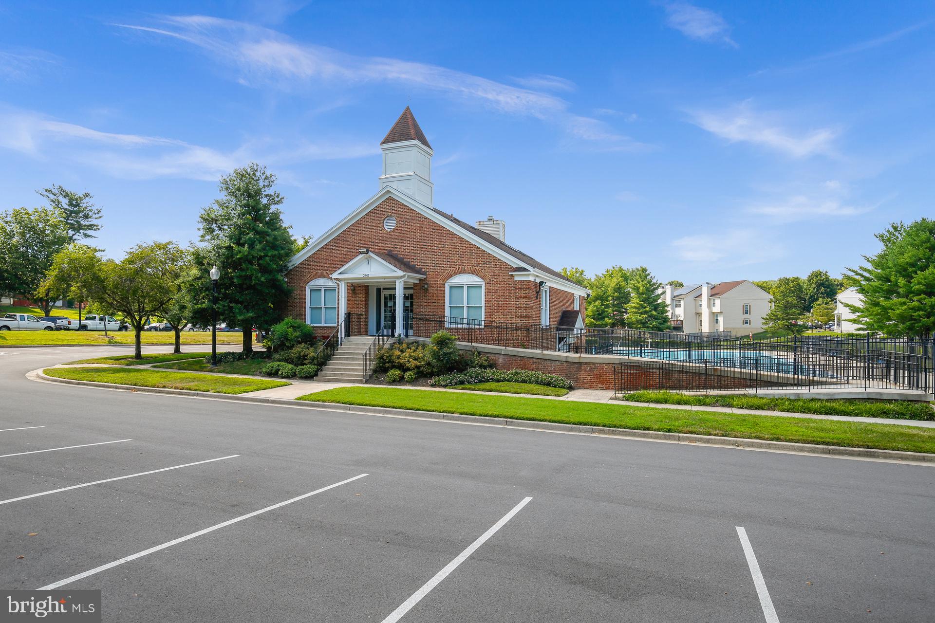 14901 Running Ridge Lane Silver Spring, MD 20906 - Photo 46 of 49 a view of pool with umbrella and trees in the background