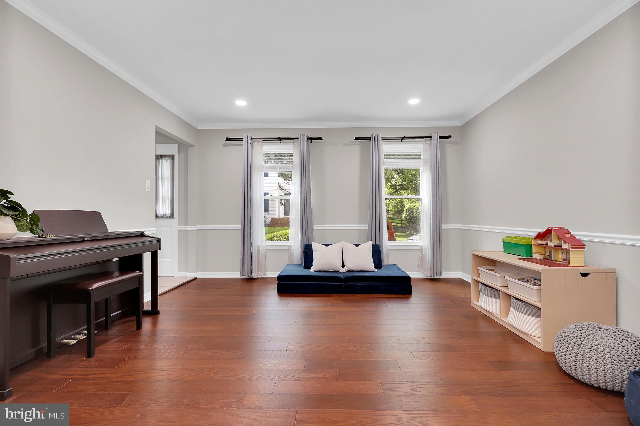14901 Running Ridge Lane Silver Spring, MD 20906 - Photo 5 of 49 a living room with furniture and a wooden floor