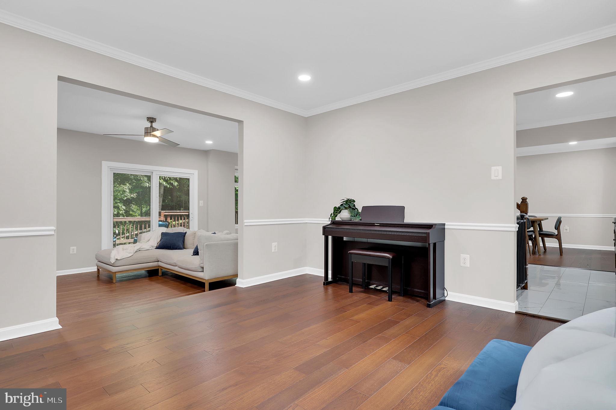 14901 Running Ridge Lane Silver Spring, MD 20906 - Photo 6 of 49 a living room with furniture and a piano