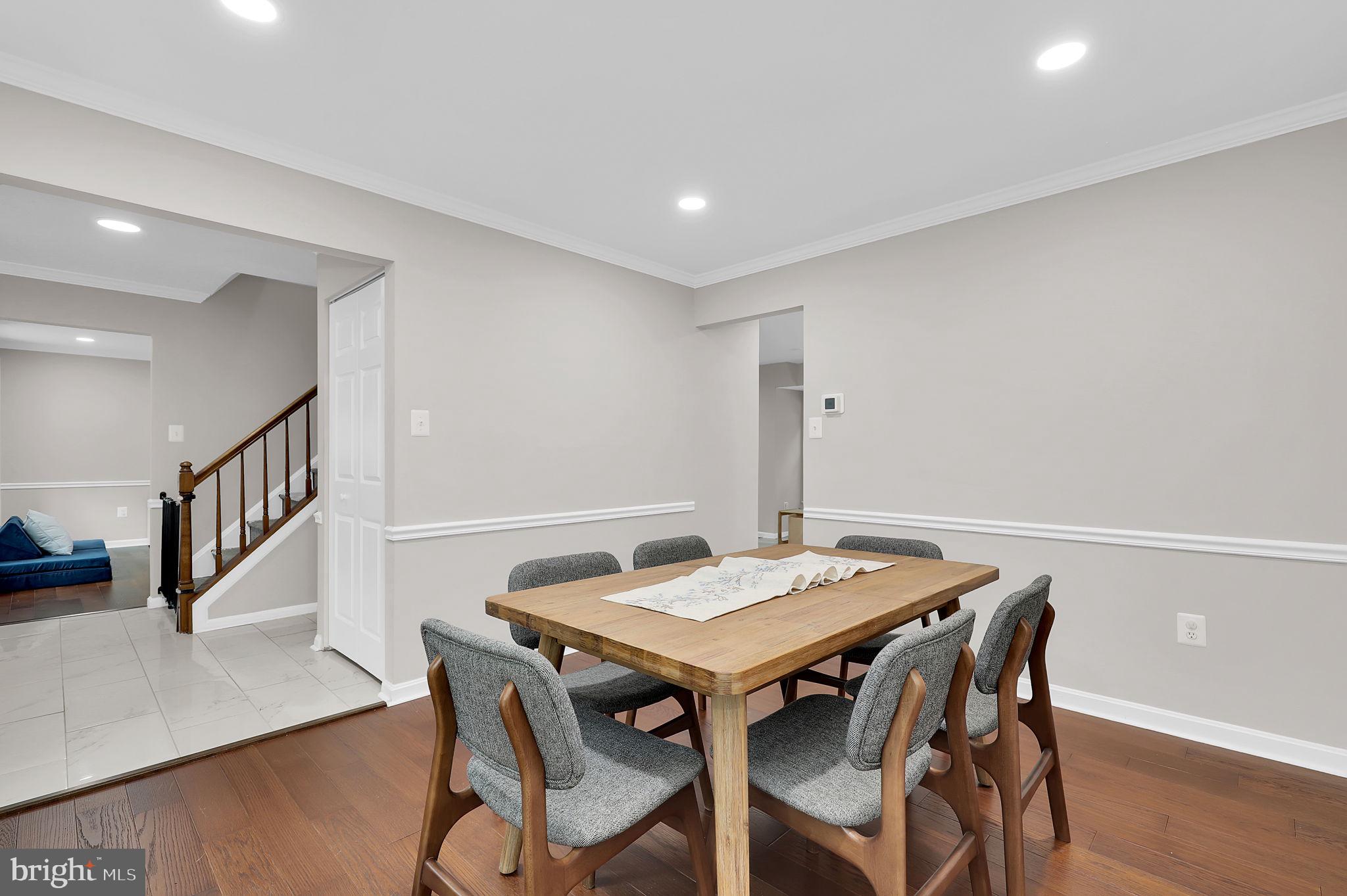 14901 Running Ridge Lane Silver Spring, MD 20906 - Photo 8 of 49 a view of a dining room with furniture and wooden floor