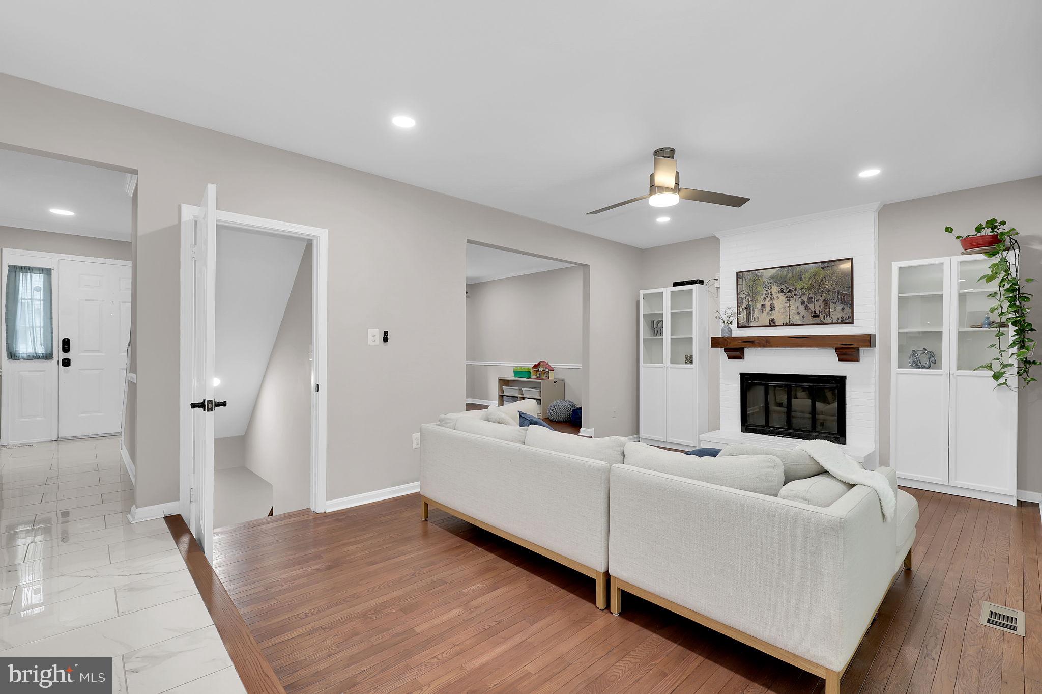 14901 Running Ridge Lane Silver Spring, MD 20906 - Photo 10 of 49 a living room with furniture and a fireplace