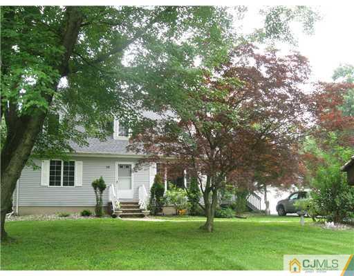 59 Henderson Road Kendall Park, NJ 08824 - Photo 5 of 12 a front view of house with yard and green space