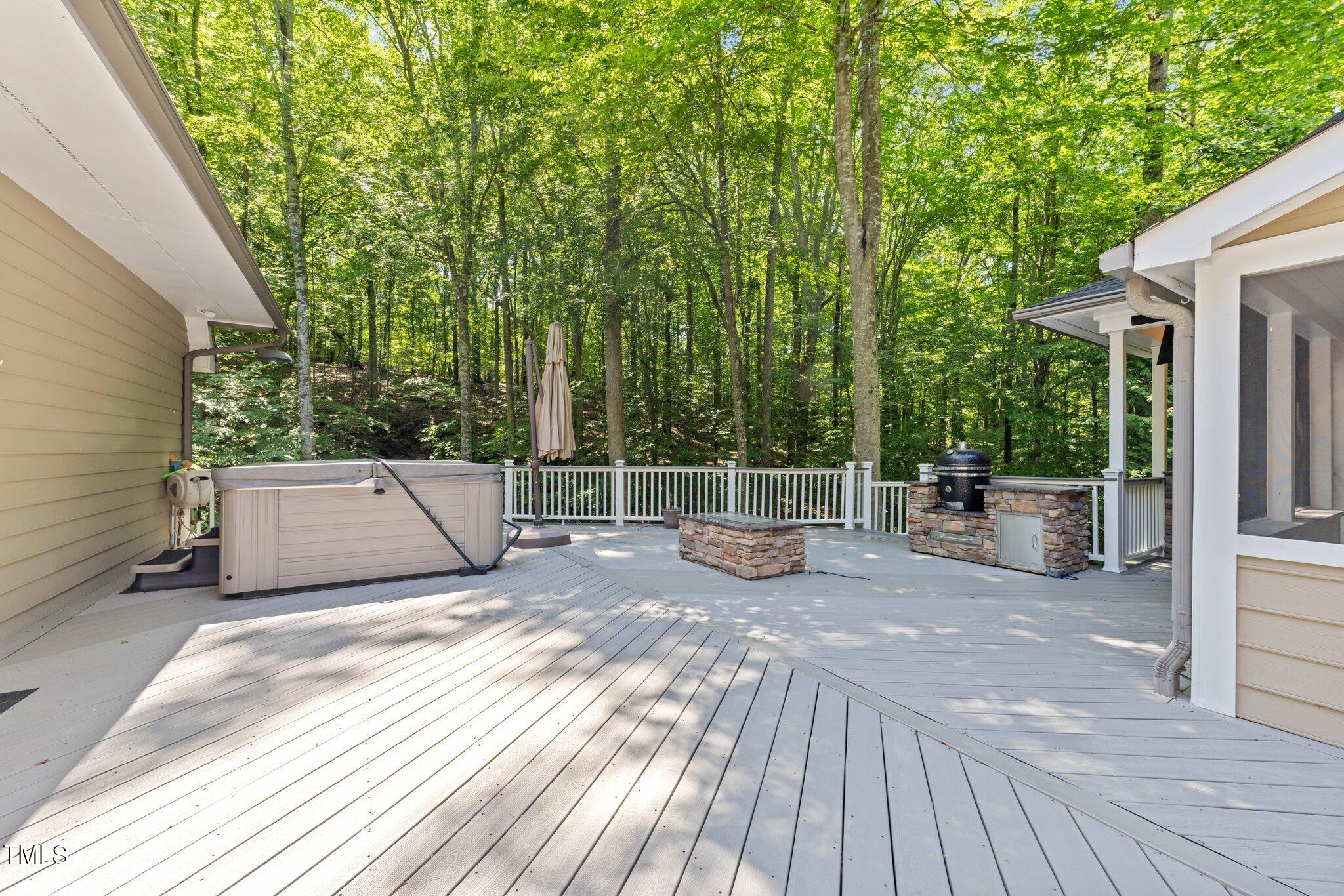 11425 Horseman's Trail Raleigh, NC 27613 - Photo 12 of 64 a view of a deck with wooden floor and fence