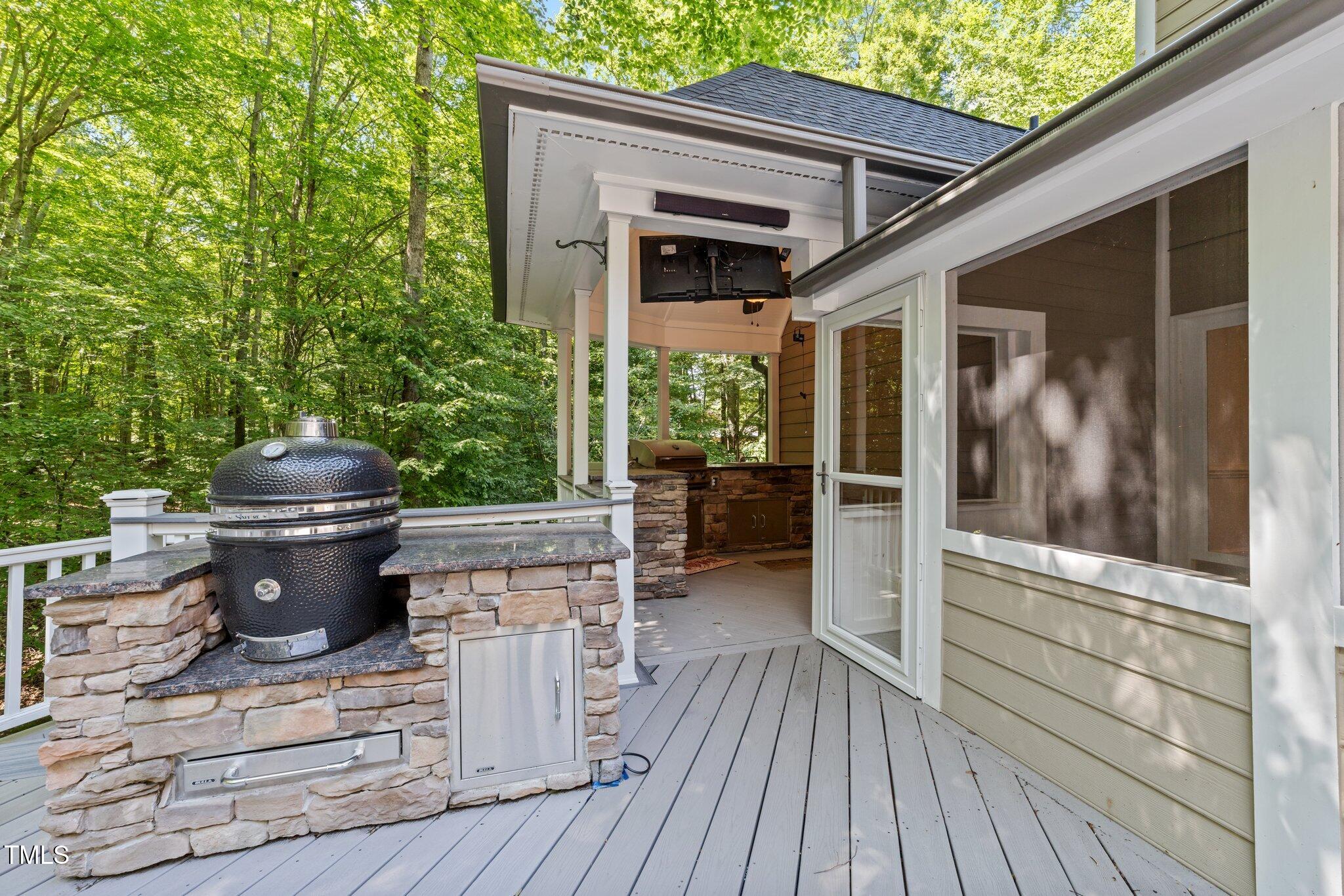 11425 Horseman's Trail Raleigh, NC 27613 - Photo 13 of 64 a view of a porch with furniture and wooden floor