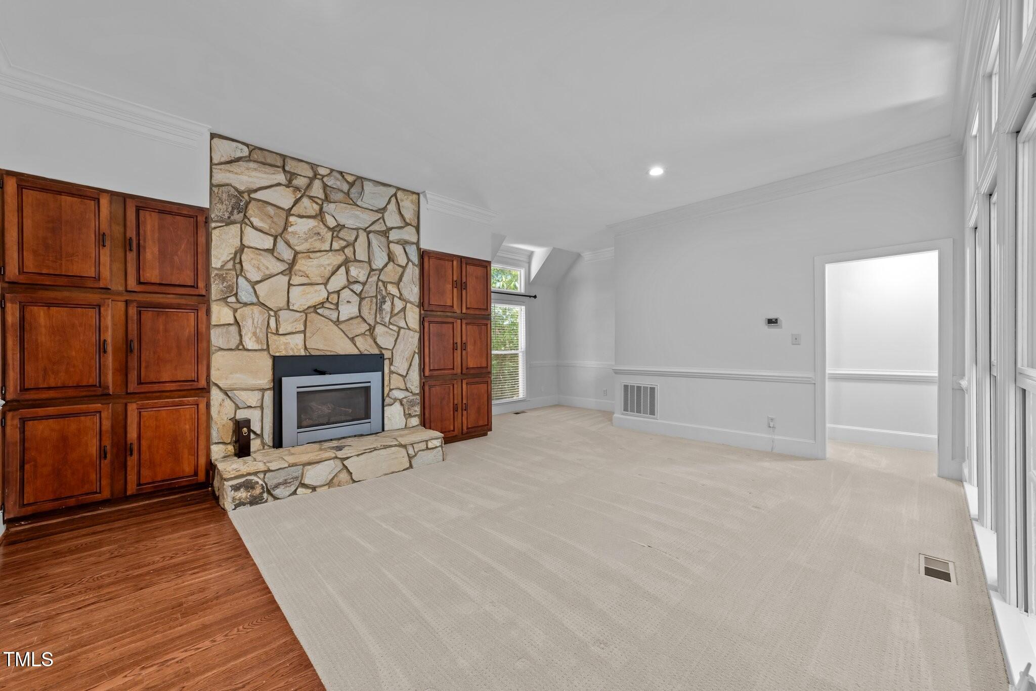 11425 Horseman's Trail Raleigh, NC 27613 - Photo 15 of 64 a view of a livingroom with a fireplace
