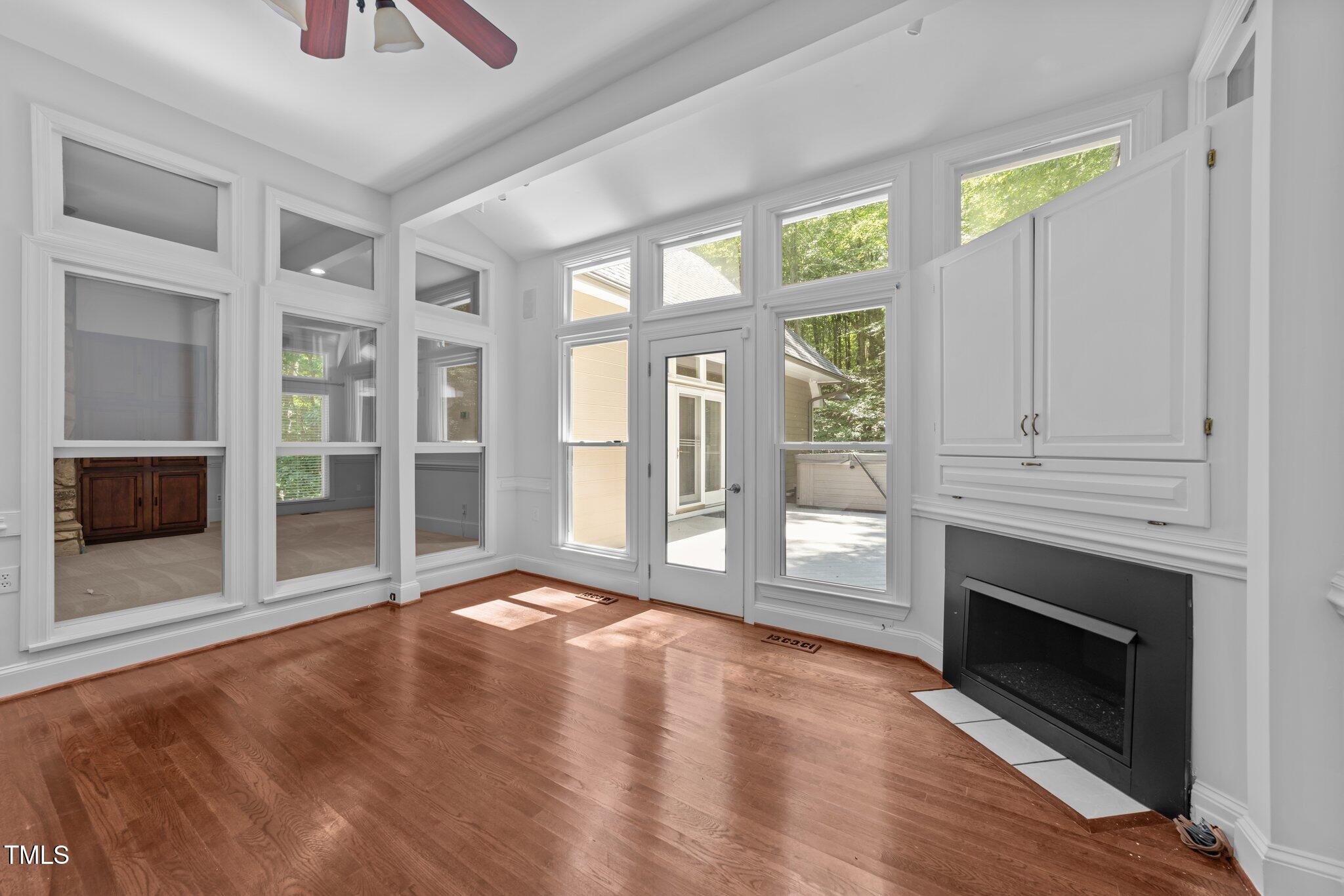 11425 Horseman's Trail Raleigh, NC 27613 - Photo 17 of 64 a view of an empty room with window and fire place