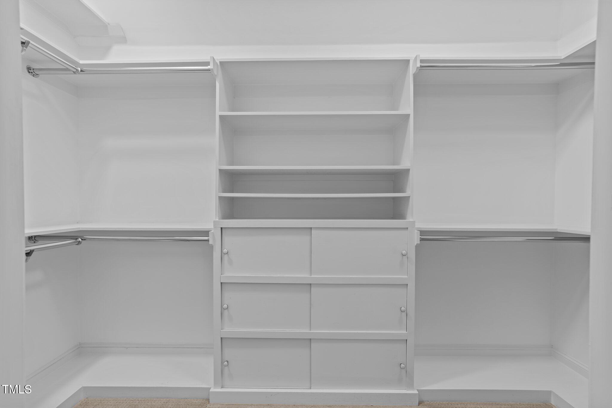 11425 Horseman's Trail Raleigh, NC 27613 - Photo 24 of 64 a view of walk in closet with empty racks