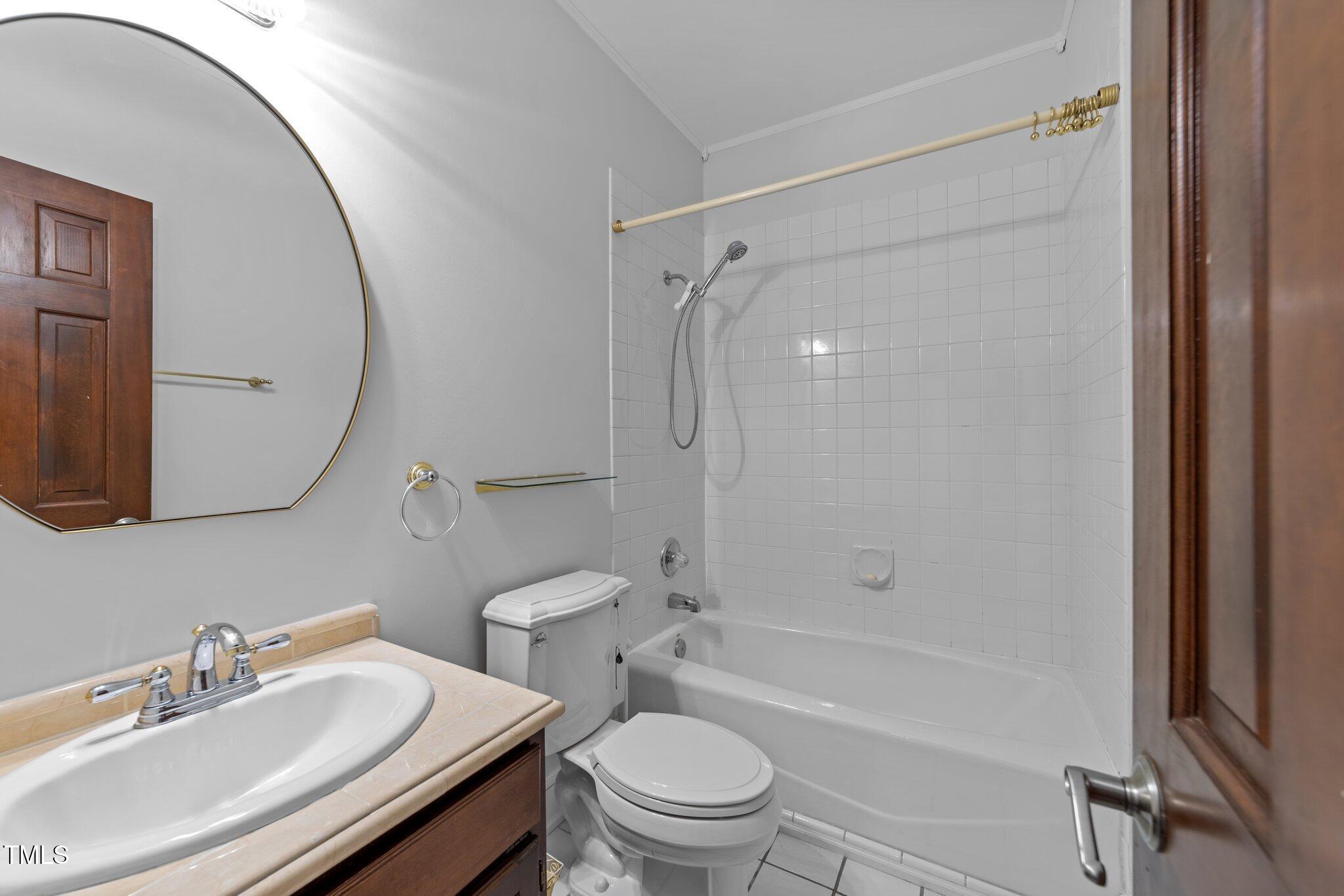 11425 Horseman's Trail Raleigh, NC 27613 - Photo 27 of 64 a bathroom with a sink toilet and shower