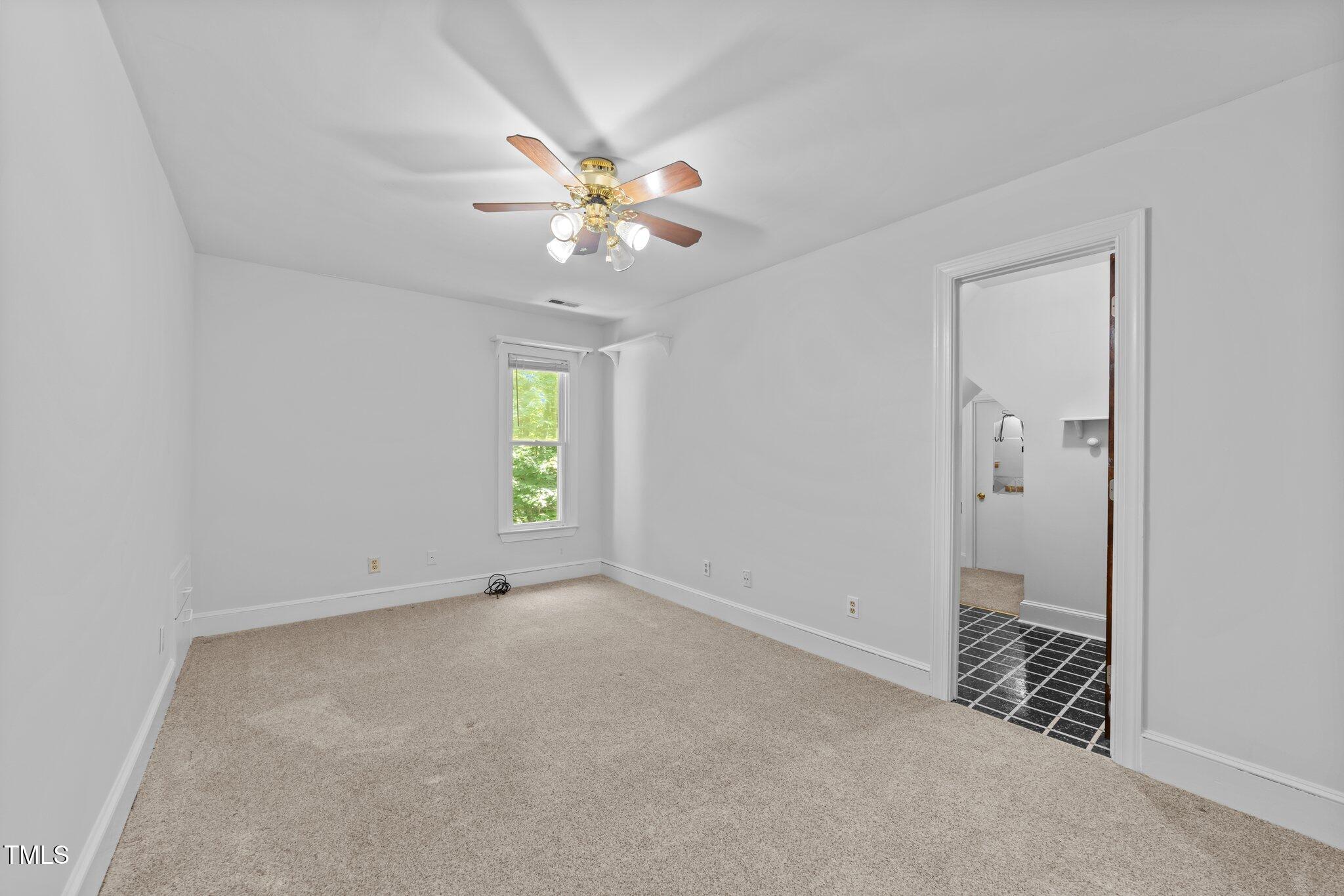 11425 Horseman's Trail Raleigh, NC 27613 - Photo 29 of 64 a view of an empty room with a window