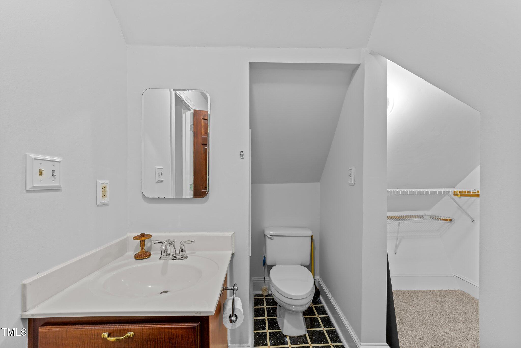 11425 Horseman's Trail Raleigh, NC 27613 - Photo 31 of 64 a bathroom with a sink toilet and shower