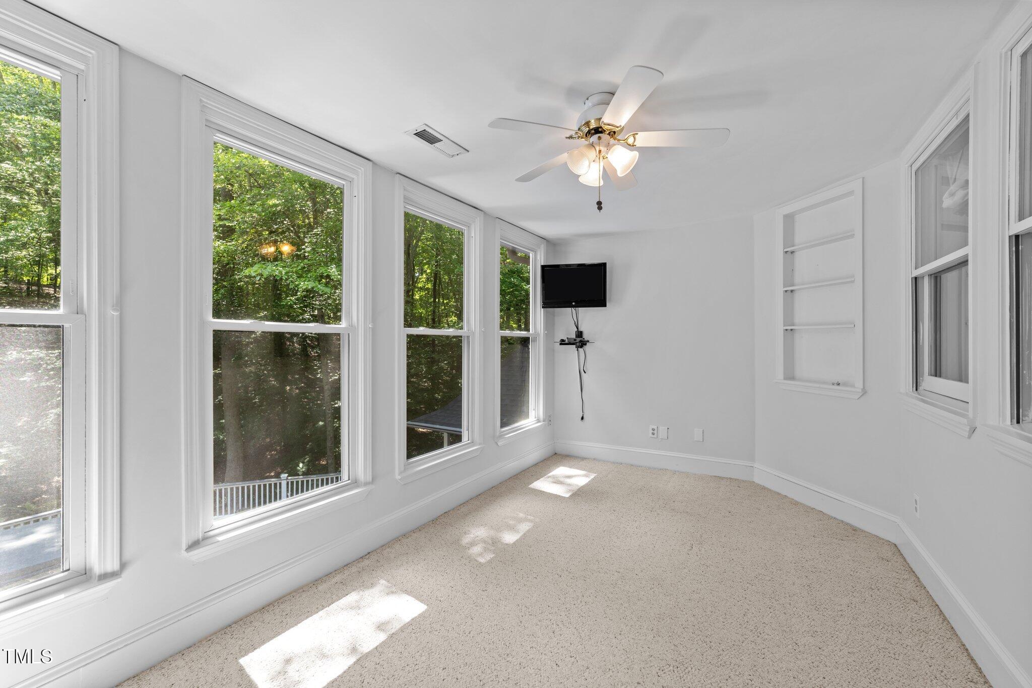 11425 Horseman's Trail Raleigh, NC 27613 - Photo 39 of 64 a view of an empty room with a window
