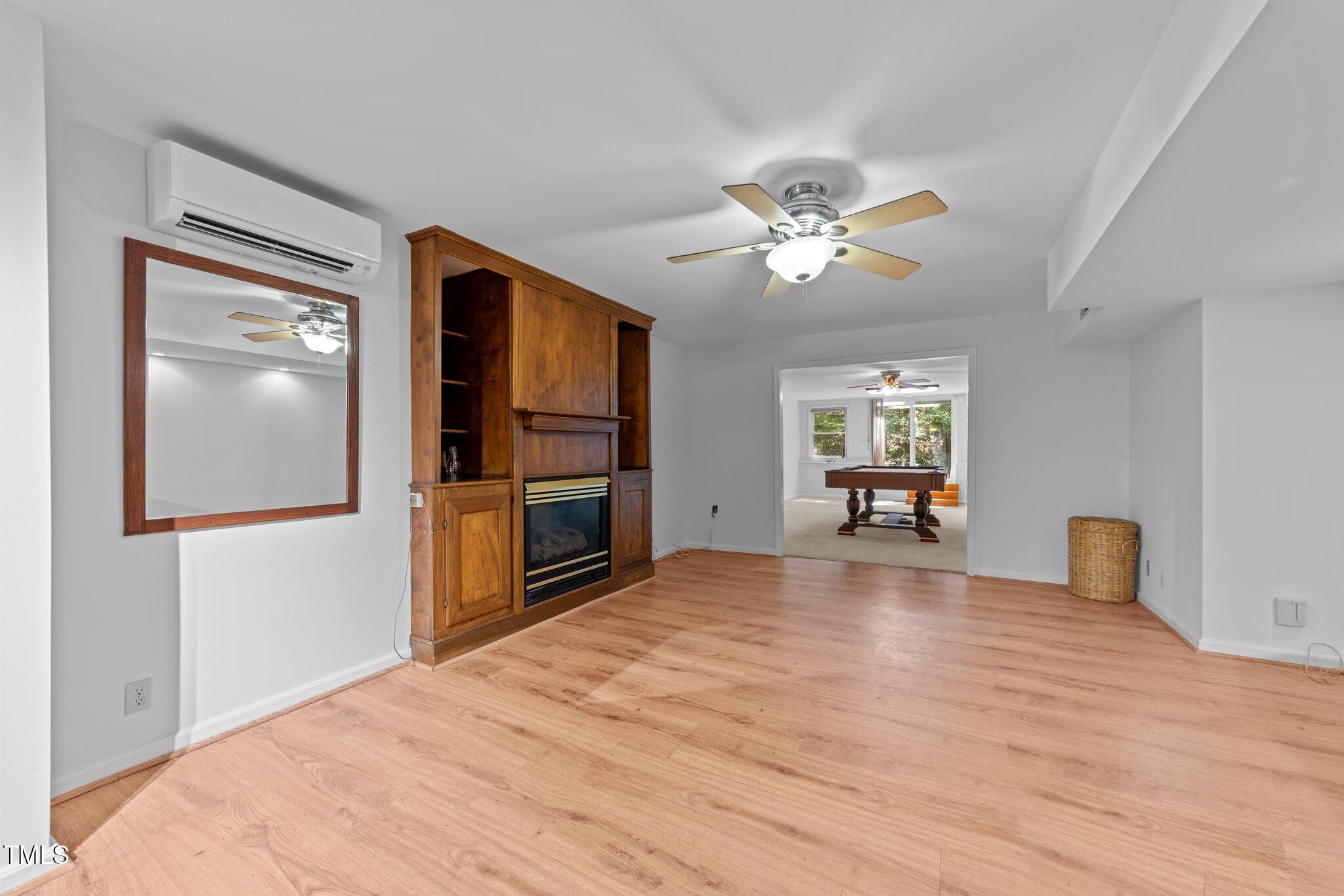 11425 Horseman's Trail Raleigh, NC 27613 - Photo 45 of 64 a view of livingroom with hardwood floor and ceiling fan