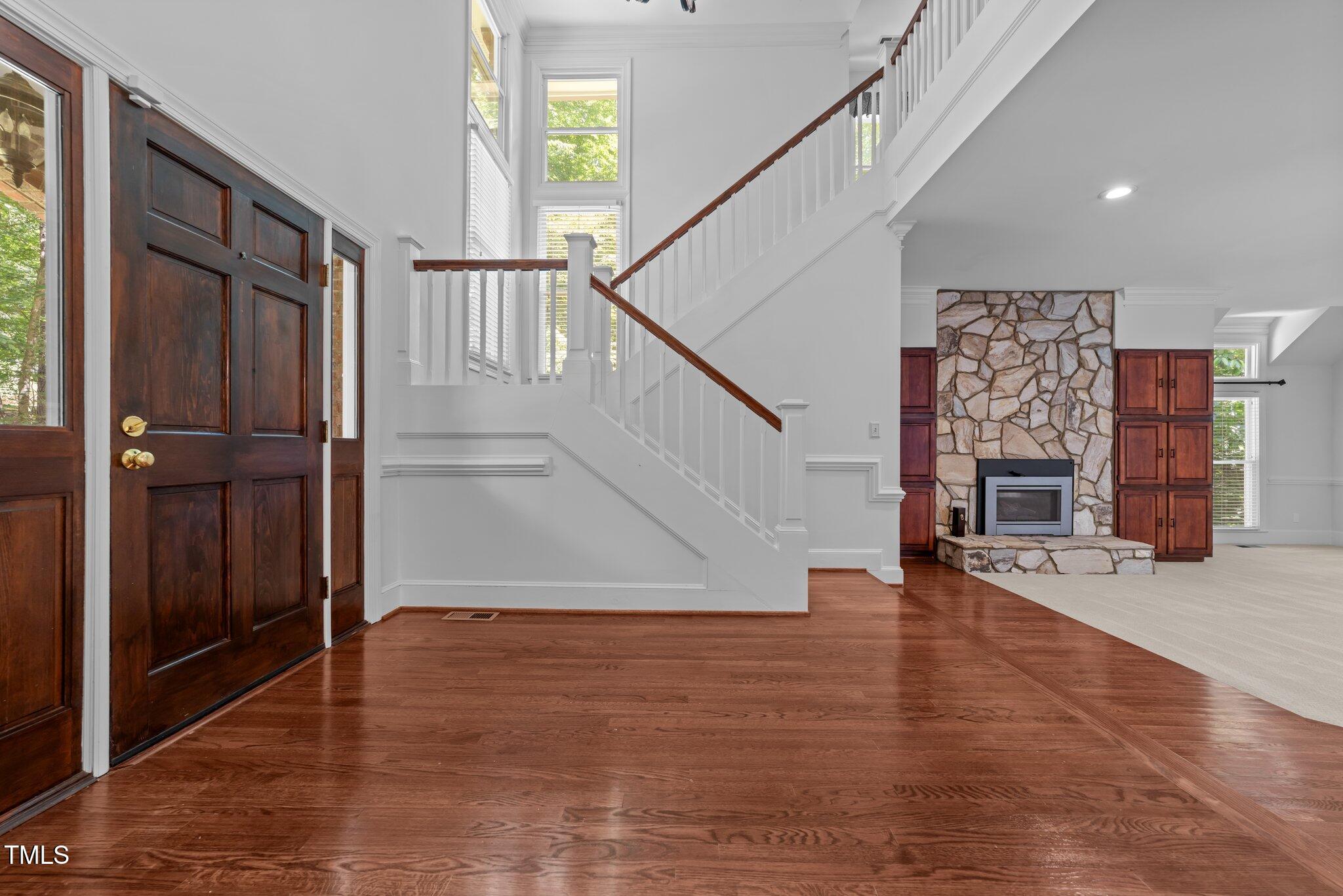 11425 Horseman's Trail Raleigh, NC 27613 - Photo 6 of 64 a view of entryway and hall with wooden floor