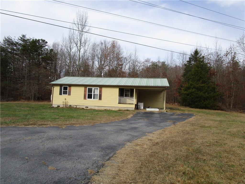 3666 Westmoreland Road Cleveland, GA 30528 - Photo 1 of 1 a front view of a house with garden
