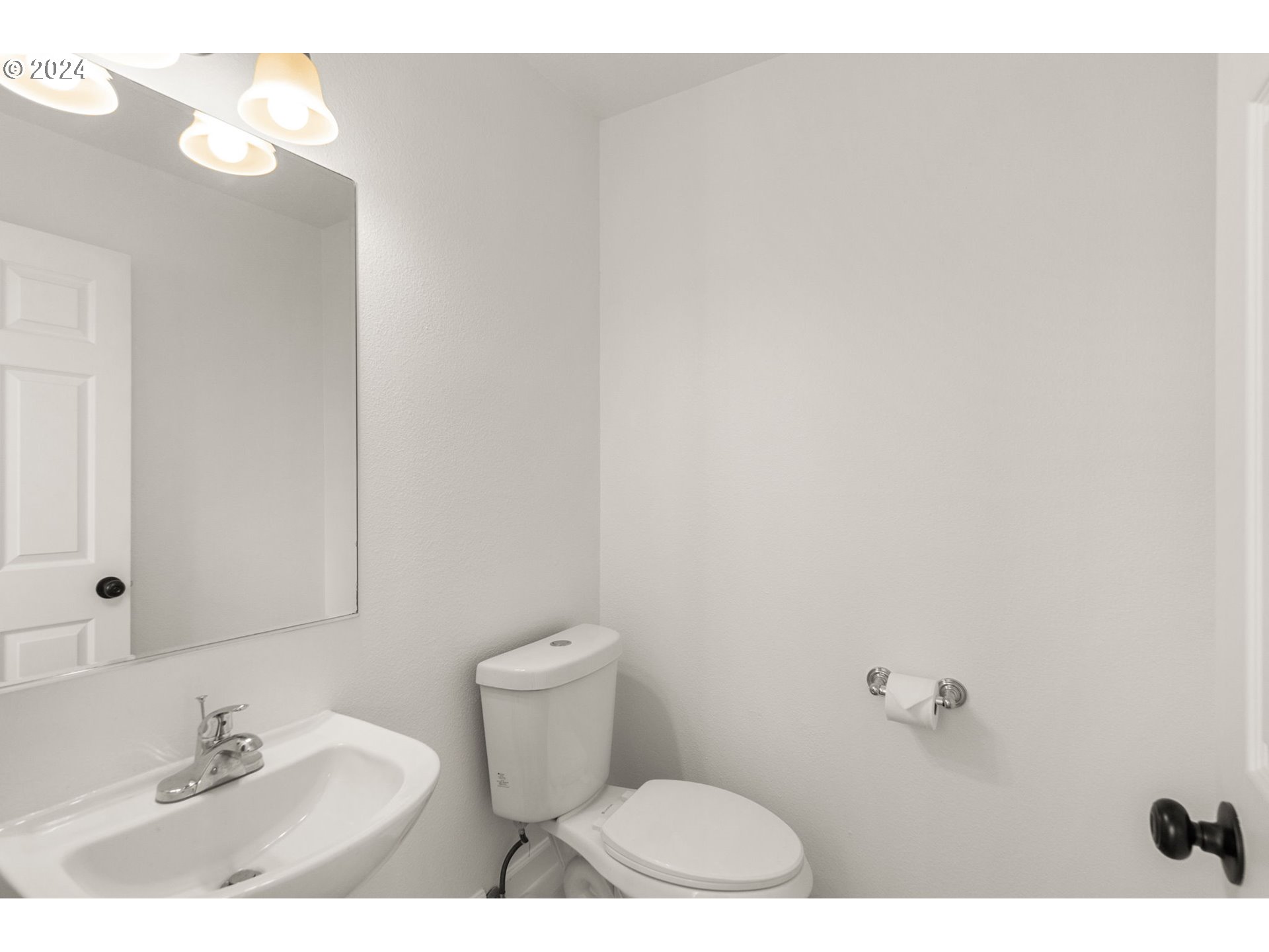 2501 Northwest 1st Drive Gresham, OR 97030 - Photo 24 of 27 a bathroom with a sink and a toilet