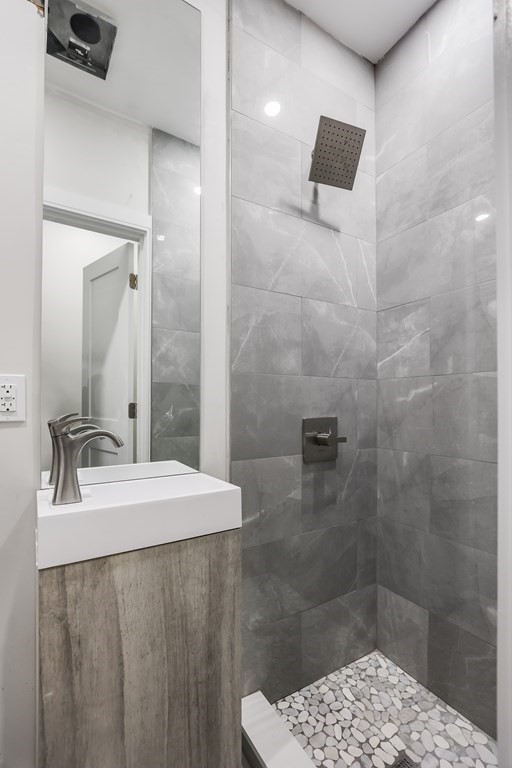 17 Sheafe Street, Unit 4 Boston, MA 02113 - Photo 5 of 6 a bathroom with a sink a shower and a mirror