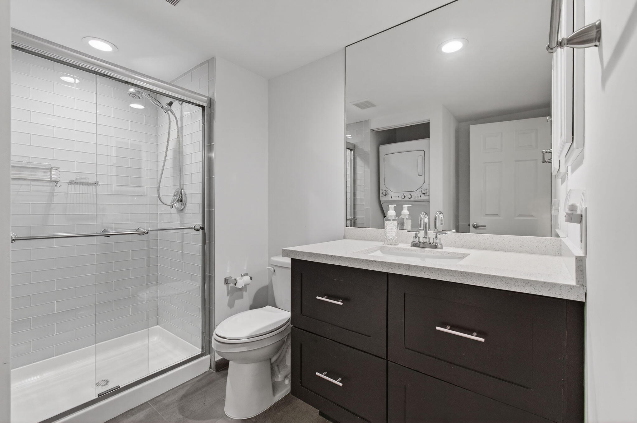 8536 Casa Del Lago, Unit 49B Boca Raton, FL 33433 - Photo 43 of 79 a bathroom with a toilet a sink and mirror