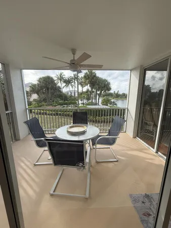 a view of a chair and table in the balcony