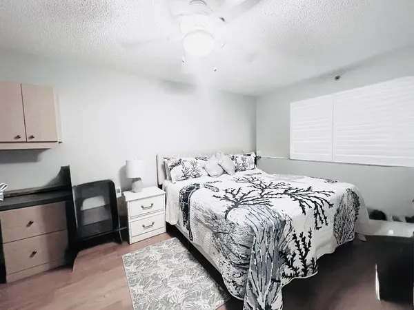 a bedroom with a bed and a dresser