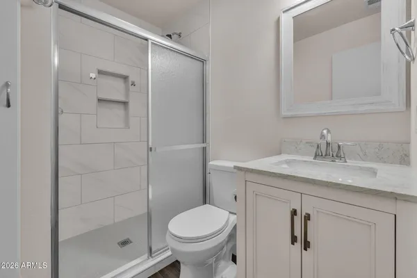 a utility room with cabinets washer and dryer