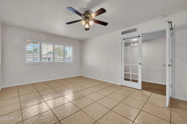 a view of an empty room with a window