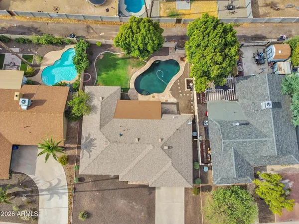 an aerial view of residential houses with outdoor space