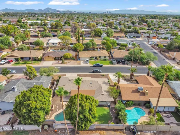 an aerial view of a house with outdoor space