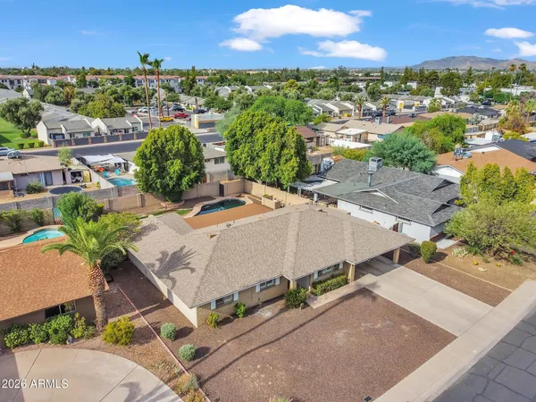 an aerial view of residential houses with outdoor space