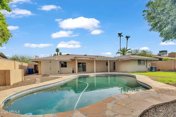 a house view with a backyard space