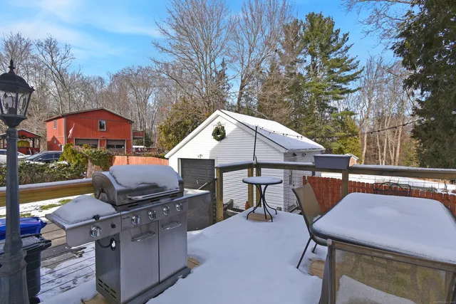 a patio with table and chairs