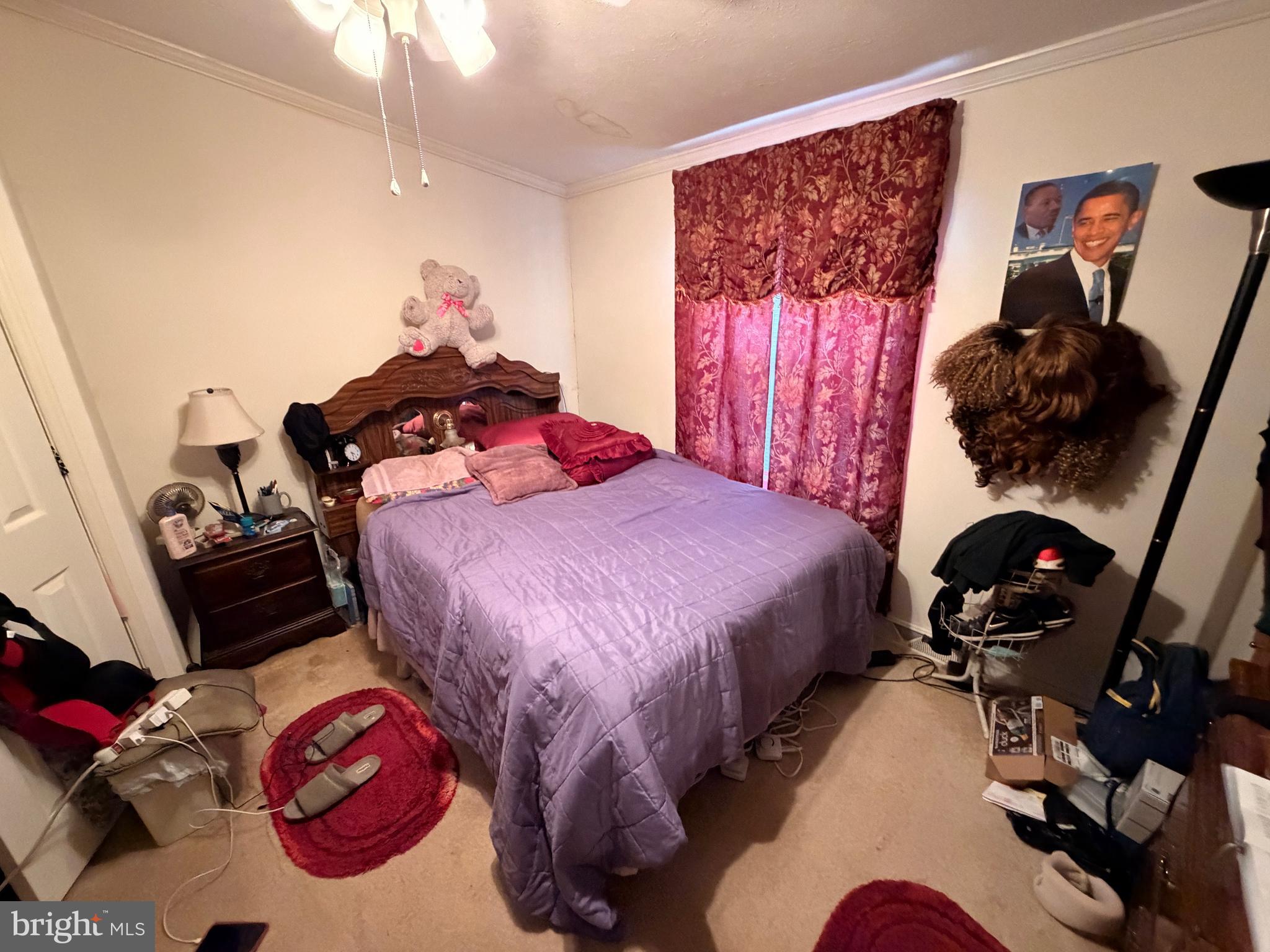 6565 Cabin Ridge Road Hurlock, MD 21643 - Photo 10 of 14 a bedroom with bed and a closet