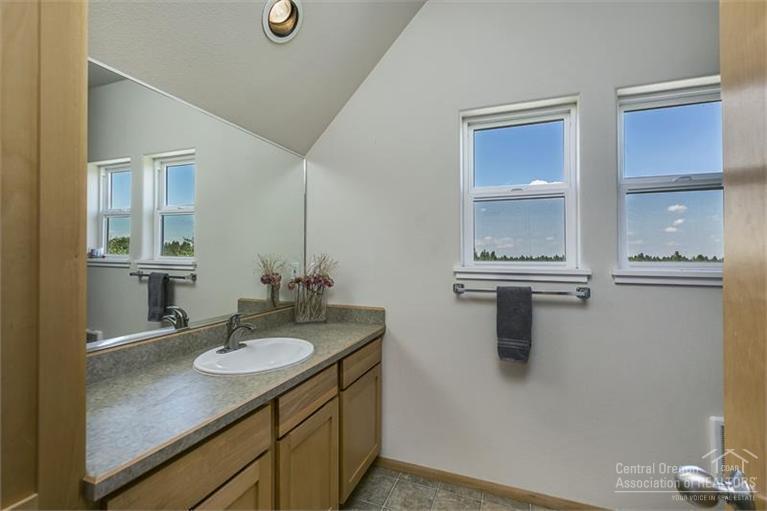 60366 Arnold Market Road Bend, OR 97702 - Photo 24 of 25 a bathroom with a sink vanity and a mirror