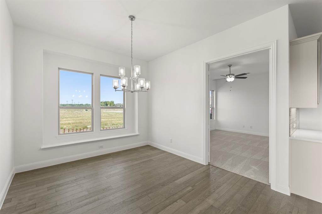 1442 Canadian Lane Van Alstyne, TX 75495 - Photo 11 of 27 a view of a room with wooden floor and entryway