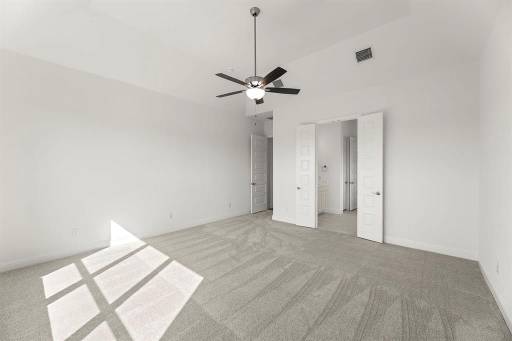1442 Canadian Lane Van Alstyne, TX 75495 - Photo 14 of 27 a view of an empty room with a ceiling fan