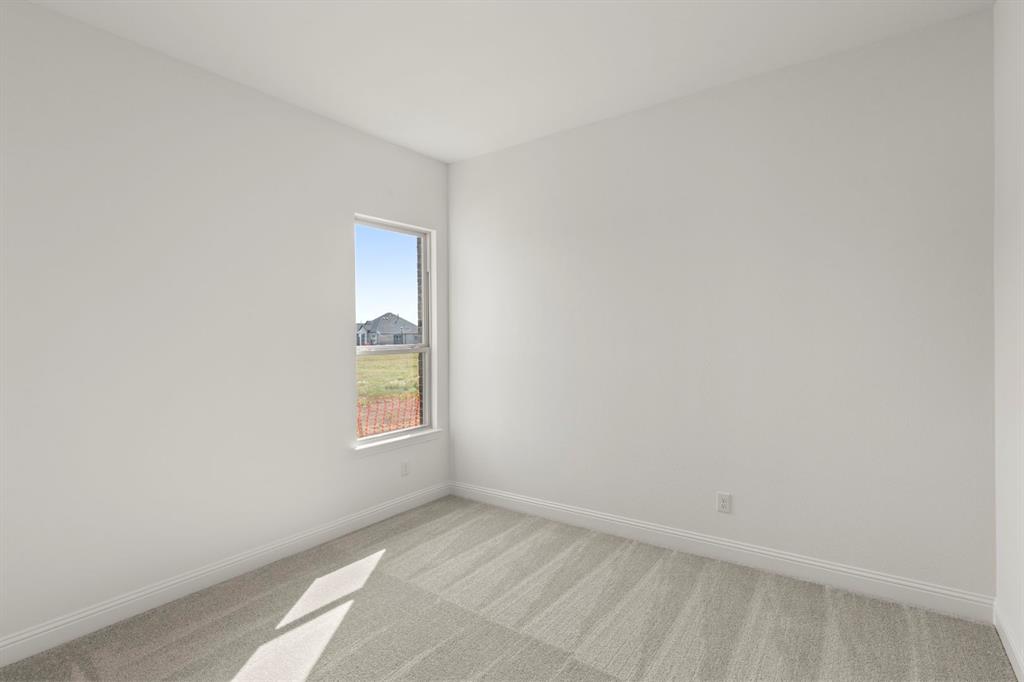 1442 Canadian Lane Van Alstyne, TX 75495 - Photo 21 of 27 an empty room with windows